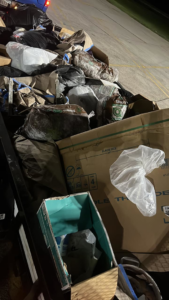 A trailer filled with bags of trash, cardboard boxes, and debris, ready for removal by Resilient Trash and Cleaning LLC in New Orleans, LA.