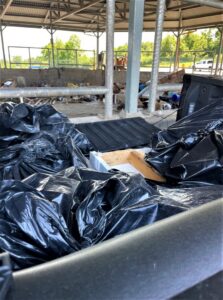 A trailer filled with black trash bags and other debris, representing a completed junk removal job by Removall Residential and Commercial Cleanout Services in York, PA.
