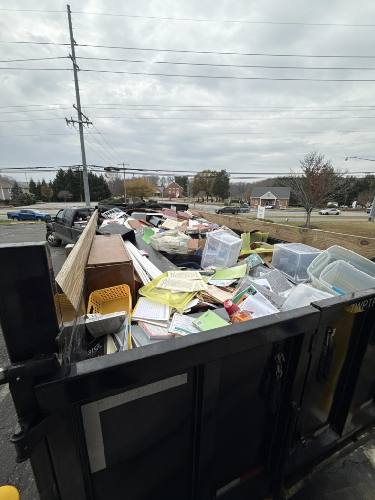 A large trailer overflowing with various junk items ready for removal by Freedom Hauling in California, MD.