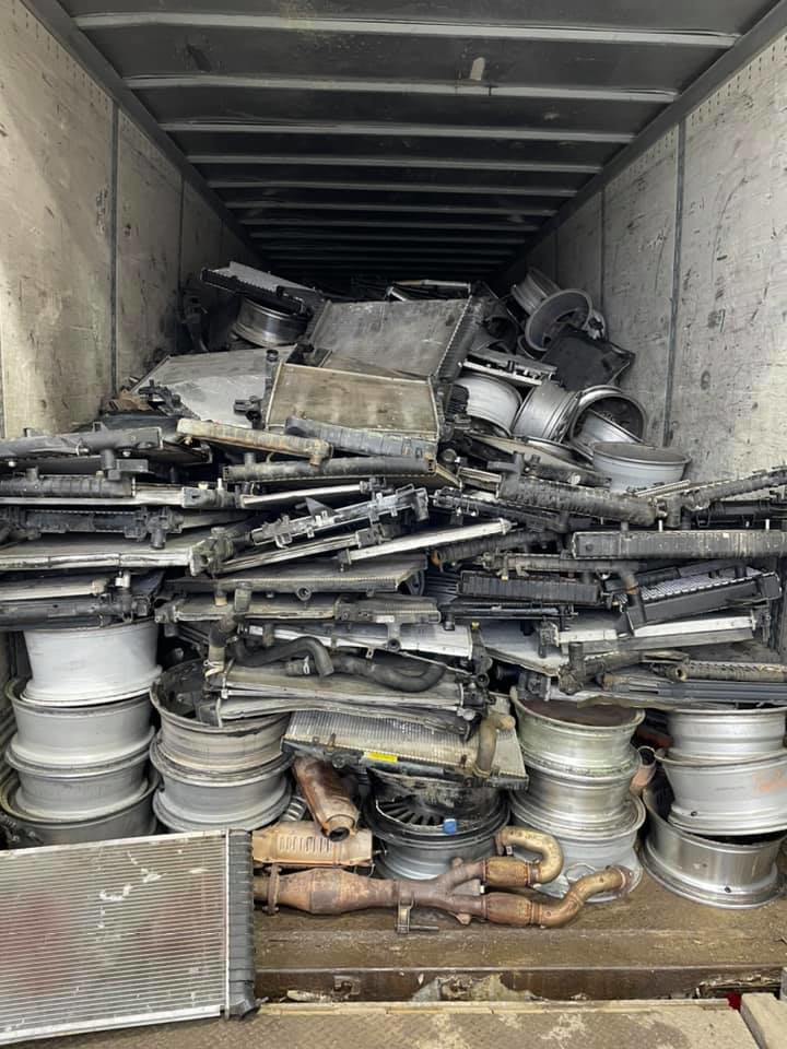 A truck trailer filled with scrap metal, including radiators and wheels, collected by Metal Recycling Inc in Johnson City, TN