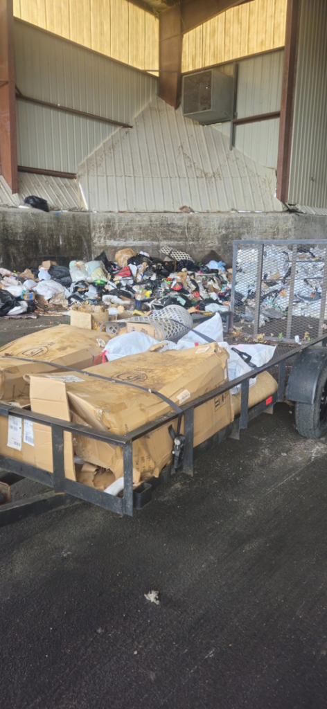 A trailer loaded with cardboard boxes and other items for junk disposal by JUNK BRO'S in Hickory, NC.
