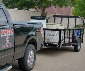 Inside view of a Junk Something llc trailer loaded with boxes and junk for removal in Dallas, TX.
