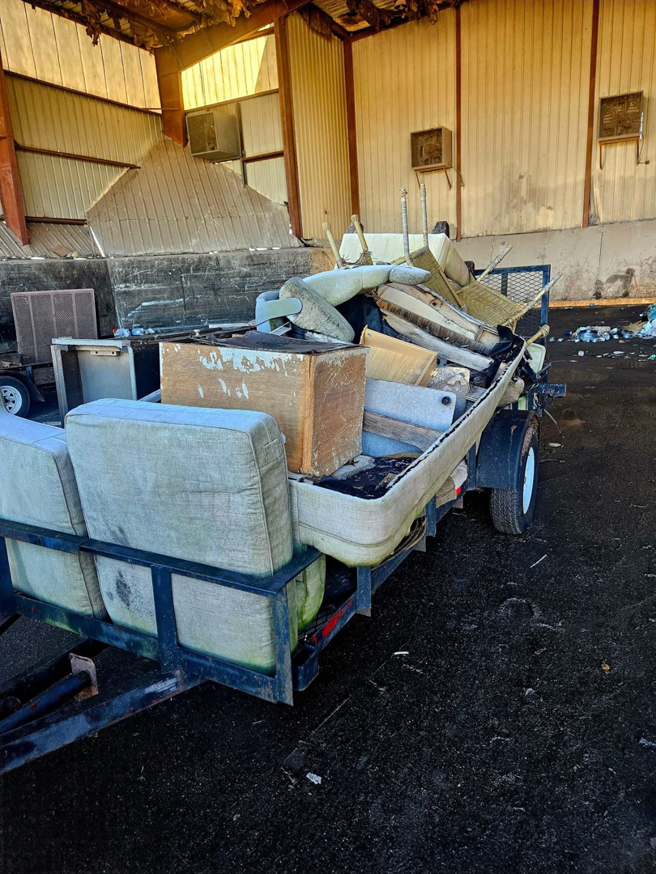 A trailer loaded with old furniture and debris, ready for removal by JUNK BRO'S in Hickory, NC.