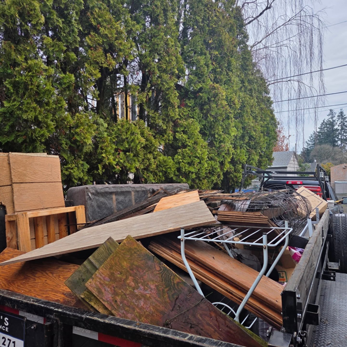 A trailer fully loaded with construction and demolition debris by Squirrel Squad LLC in Portland, OR.