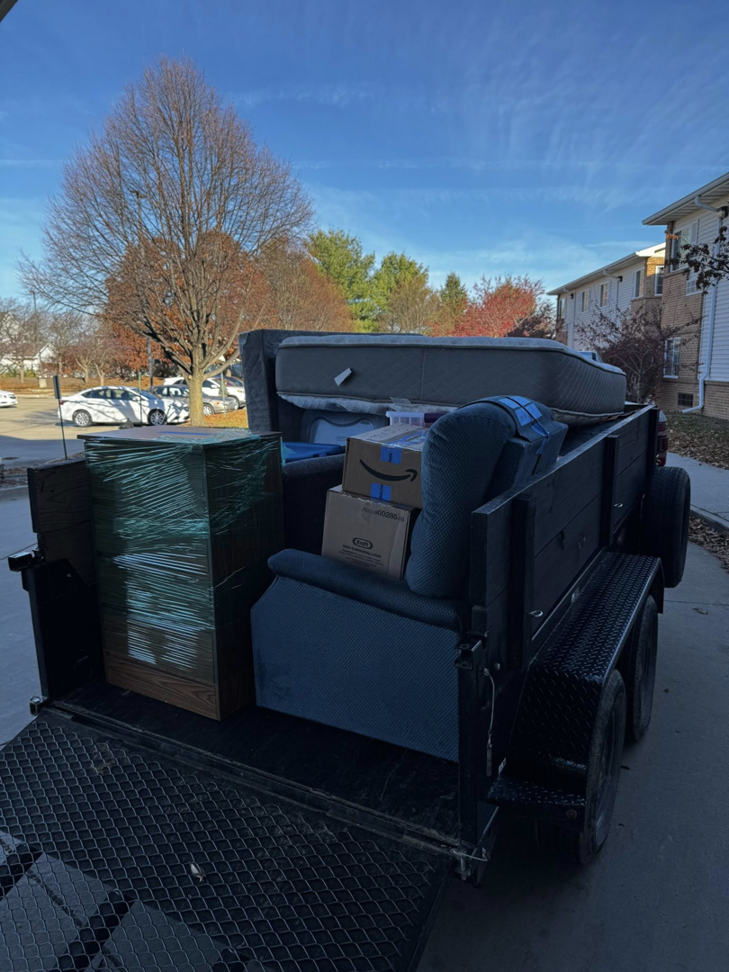 A trailer loaded with various household junk items for removal by Junk Brothers in Louisa, KY.