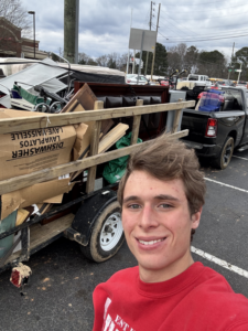 A trailer loaded with various junk items, including boxes and furniture, handled by Eagle Junk Removal in Cloverdale, CA.