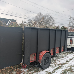 A trailer loaded with tree branches and yard waste by 5 Star Junk Removal, LLC in Elyria, OH