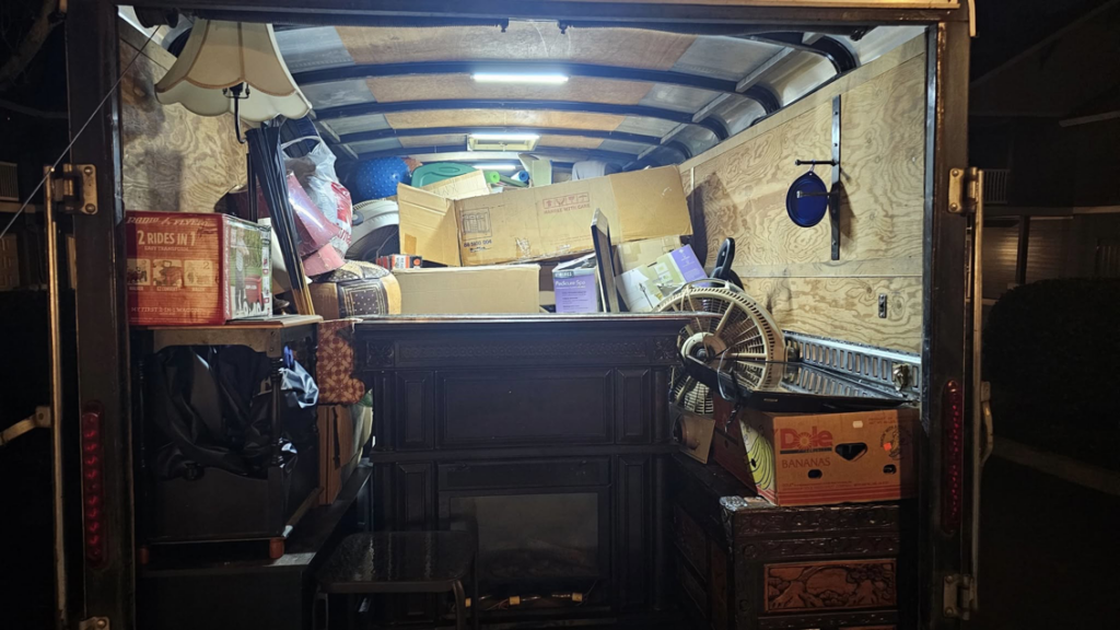 The interior of a trailer packed full of household items and boxes, showing moving or hauling services by Can Do Andrew in Gresham, OR.