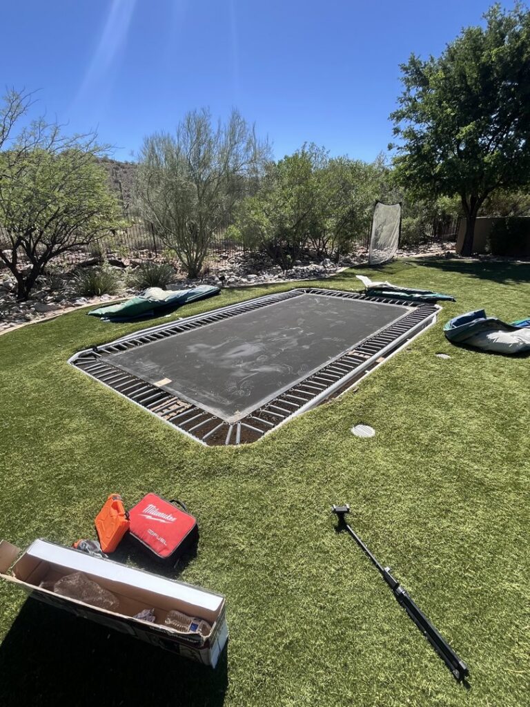 Disassembly of an in-ground trampoline for Happy Hippo Junk Removal in Scottsdale, AZ.