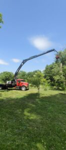 Broken Branch Tree Removal using a crane for tree branch trimming in Broadalbin, NY.