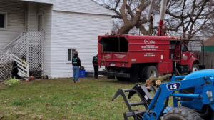 Arbor Tech Tree Specialist crew performing tree removal and chipping services in Flint, MI.