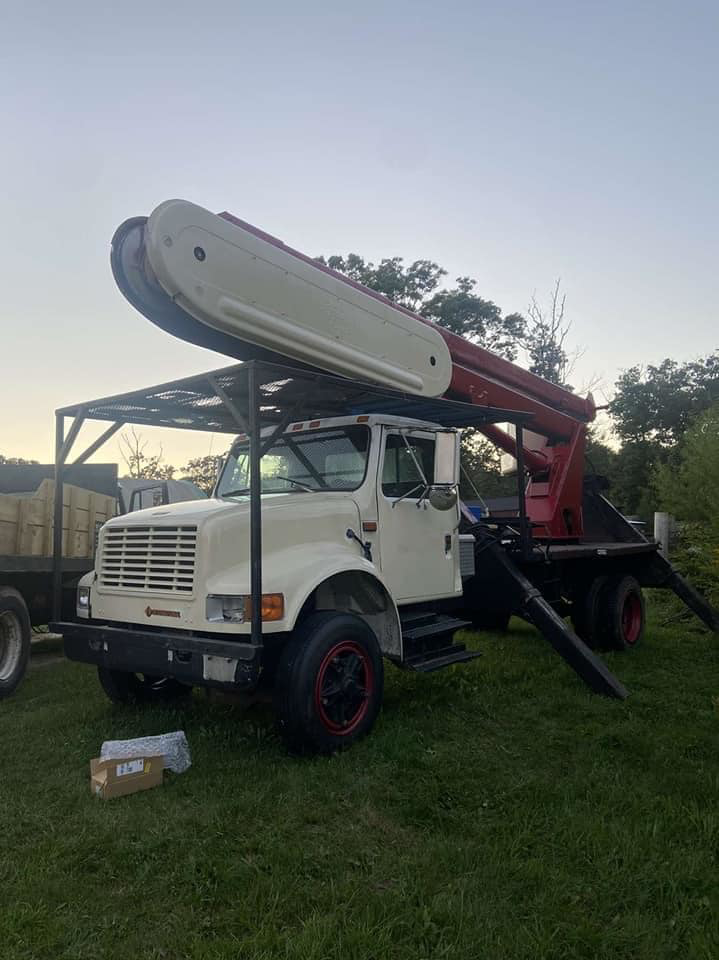 A large tree service crane truck used by 365 Trees in East Providence, RI.