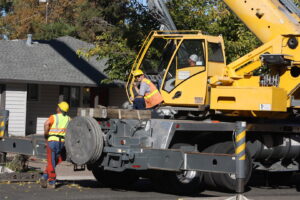 A tree service crew operating a crane for heavy tree removal or lifting services by A Better Tree Service in Sacramento, CA.