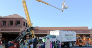 Ratliff Landscape and Tree Service LLC demonstrating tree service equipment, including a chipper and boom lift, in Murfreesboro, TN