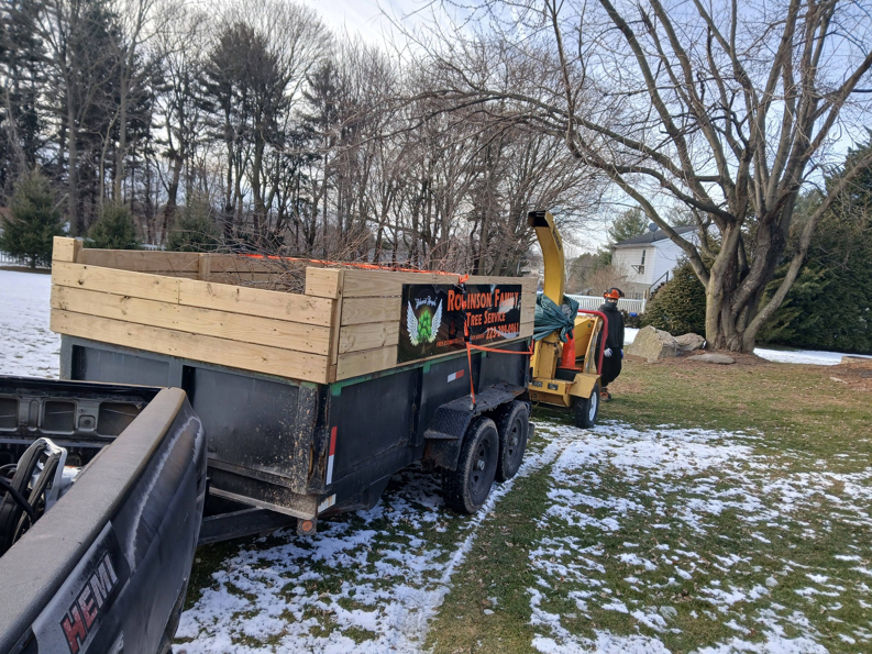 Tree service equipment including a wood chipper and trailer on a job site for RJ Robinson Family Tree Service LLC in York, PA