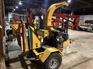 Tree service equipment, including a wood chipper and spider lift, stored by Liberty Tree in Fort Smith, AR.