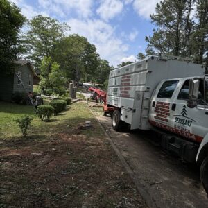 A Sergeant tree service truck and wood chipper on a residential job site for tree removal in Atlanta, GA