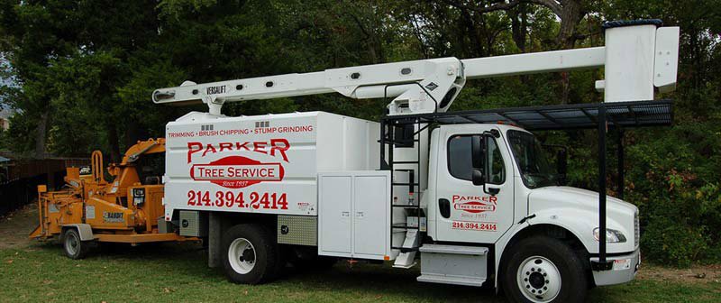 A Parker TX Tree Service truck with an attached wood chipper, ready for tree removal and brush chipping in Plano, TX.
