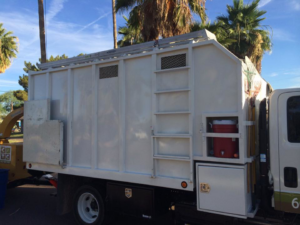 Side view of a tree service truck with storage and equipment from Creative Tree Care, LLC in Phoenix, AZ.