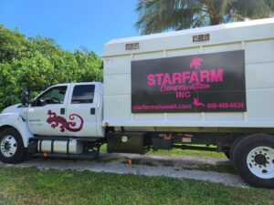 A white tree service truck with Starfarm Tree Service Hawaii branding parked in Kapolei, HI, ready for a job.