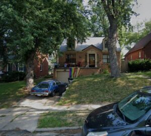 A tree service worker cleaning up a lawn with a leaf blower after tree removal by A to Z Trees and More LLC in Omaha, NE.