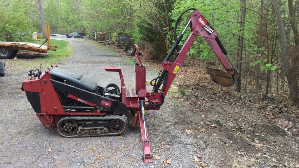 A trenching machine used for digging fence or deck post holes by Quality Fence & Deck Co. in Frederick, MD.