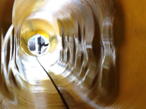 View inside a pipe showing trenchless pipe lining installation by Precision Industrial Maintenance, Inc. in Schenectady, NY.