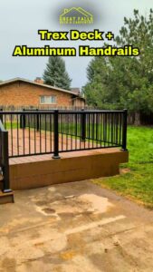 A durable Trex deck complemented by modern aluminum handrails, installed by Great Falls Deck & Carpentry in Great Falls, MT.