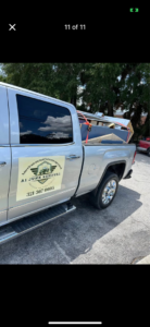 A pickup truck bed full of construction debris and household junk being removed by A1 JUNK Removal in Cocoa Beach, FL.