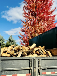 A truck bed filled with freshly cut firewood, ready for delivery or disposal, from Snyder's Tree Service LLC in Fort Wayne, IN.