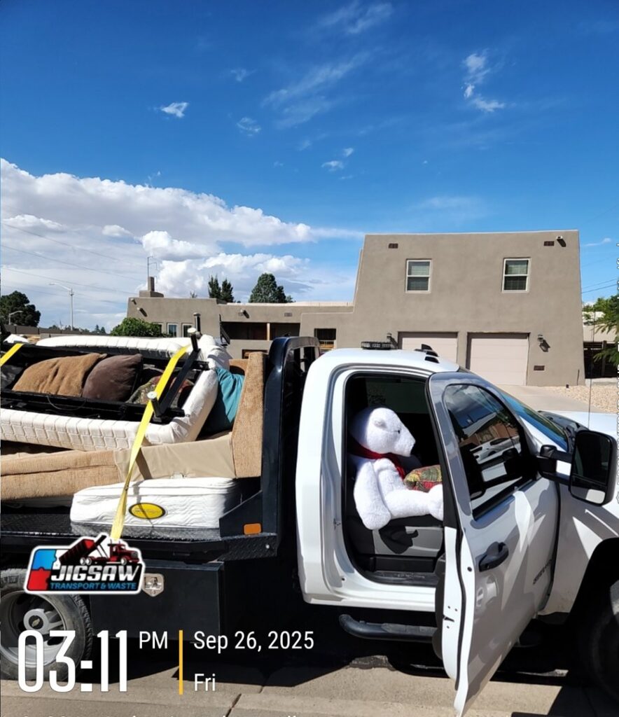 A truck loaded with furniture and other junk for removal by Jigsaw Transport and Waste in Albuquerque, NM.