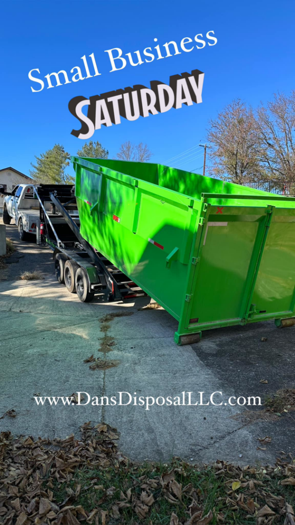 A Dan's Disposal LLC truck transporting a bright green dumpster on a sunny day in Richmond, KY.