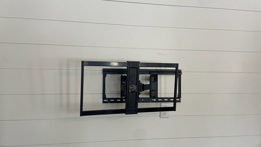 A heavy-duty television wall mount installed on a shiplap wall, ready for a TV, by T&K Services in Idaho Falls, ID