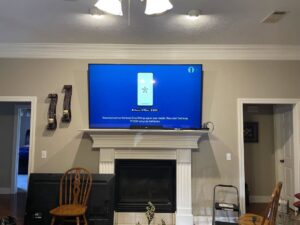 A large TV mounted above a fireplace by BK's Handyman Services in Carlton, OR.