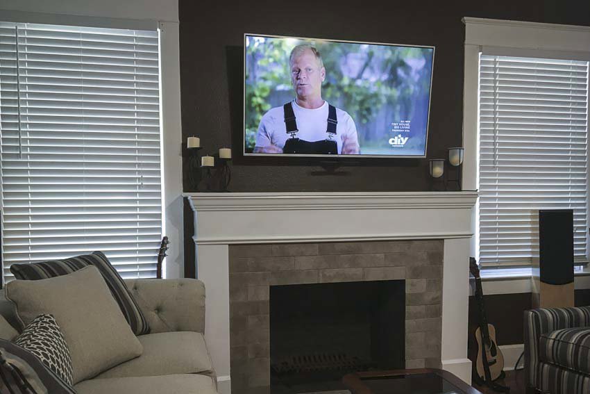 Professional TV mounting service above a fireplace by My Handyman of Wichita KS in Kechi, KS.