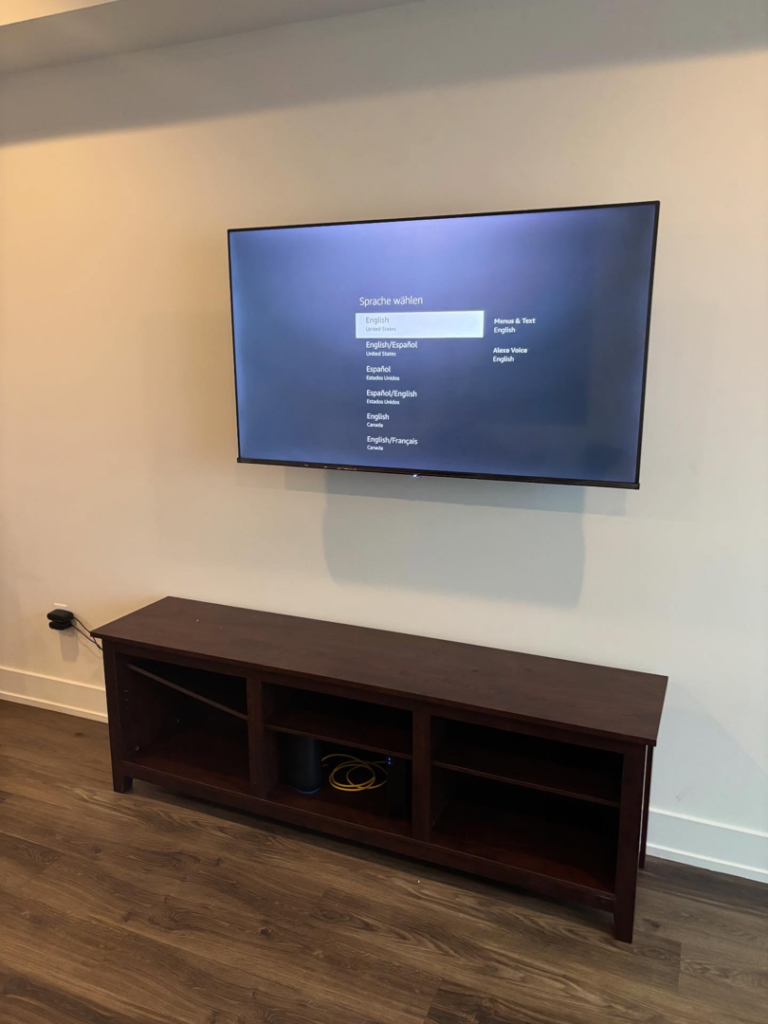 After photo of a TV mounting service by Grade A Handyman in Lancaster, CA, showing the TV mounted on the wall.