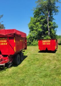 Two red dumpsters from Affordable Dumpsters, showing equipment for junk removal services in Watervliet, NY.