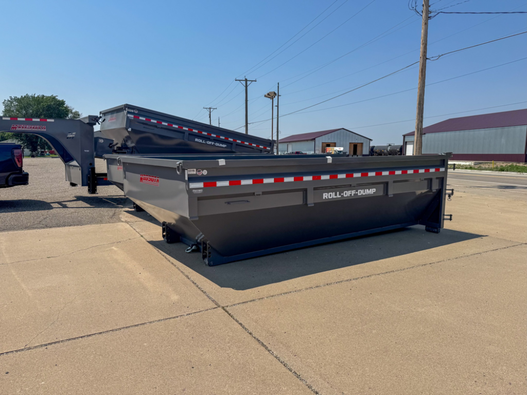 Two empty roll-off dumpsters available for rent from ClearHouse Hauling in Huron, SD.