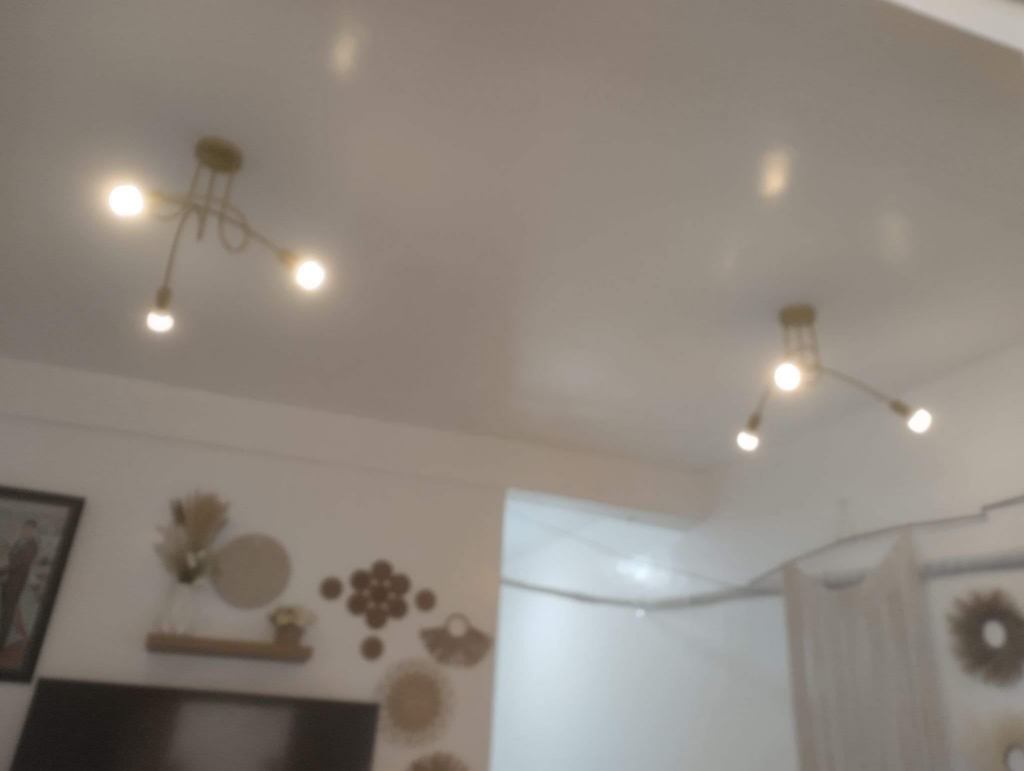 Two modern ceiling light fixtures with exposed bulbs installed by Electrician on Call and Home Service in Taguig, PH.