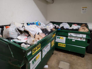 Two large dumpsters overflowing with trash, ready for general junk removal by Bay Area Bin Support in San Leandro, CA.