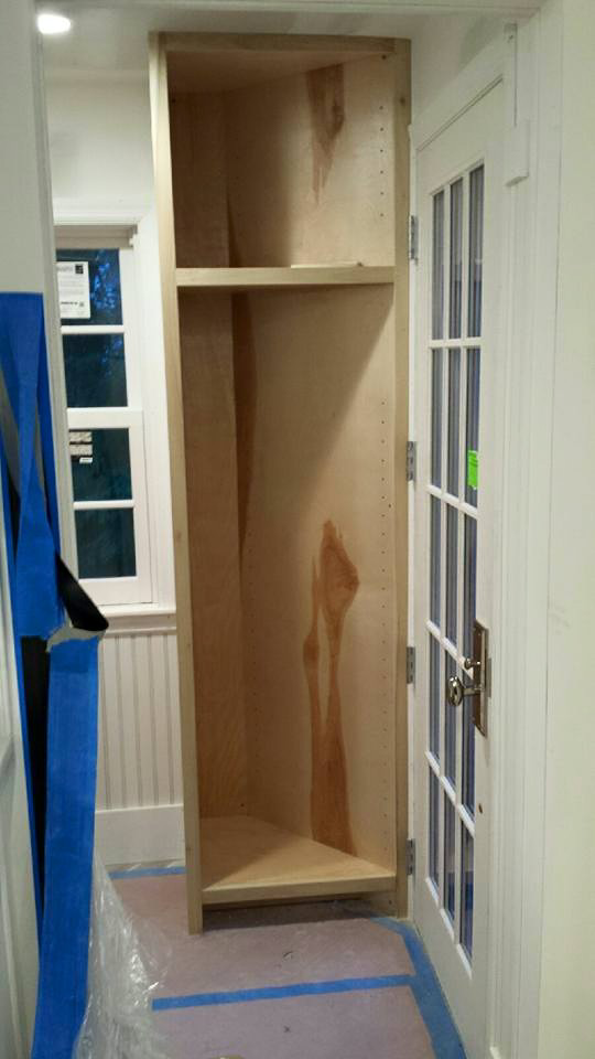 Unfinished custom cabinetry installation during a home renovation by Thomas J Stone GC in Yonkers, NY