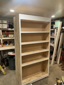An unfinished custom wooden bookshelf being built by Carolina Handyman Builder in Taylors, SC.