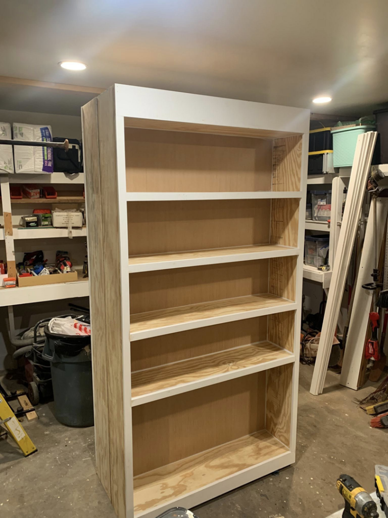 An unfinished custom wooden bookshelf being built by Carolina Handyman Builder in Taylors, SC.