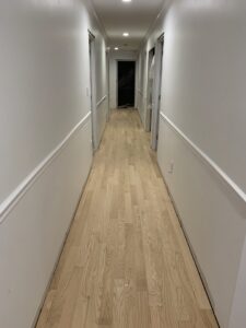 Unfinished hardwood hallway floor, ready for finishing by Just Floor It Hardwood Floors LLC in Philadelphia, PA