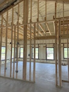 Unfinished room with spray foam insulation on walls and ceiling by IFOAM Insulation of Hill Country, a general contractor in San Antonio, TX