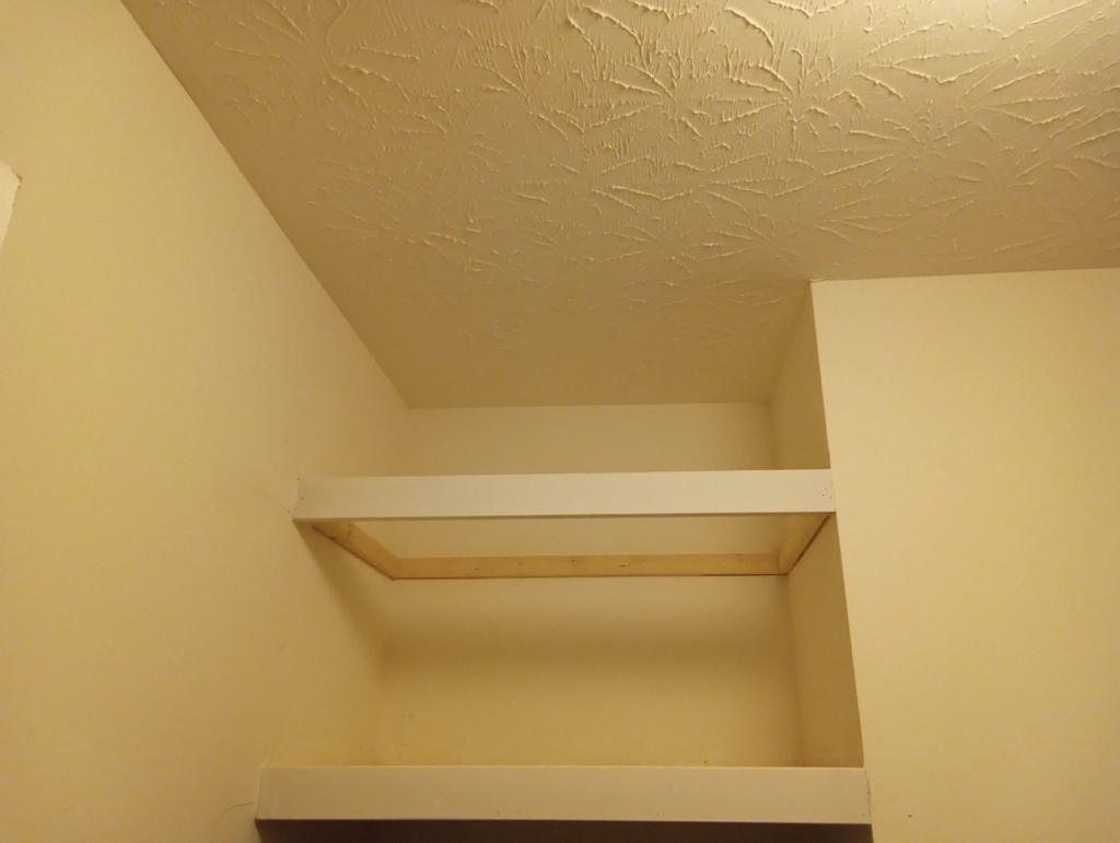 An unfinished custom shelf installation in a closet by Skilled Hands Residential Contracting in Covington, KY.