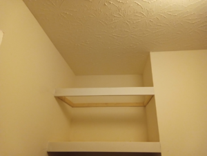 An unfinished custom shelf installation in a closet by Skilled Hands Residential Contracting in Covington, KY.