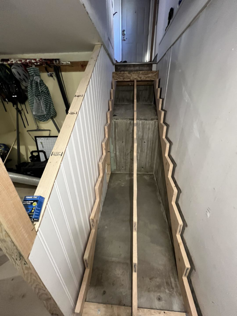 Unfinished staircase structure before carpet and paint installation by JKM Services in Solon, OH.