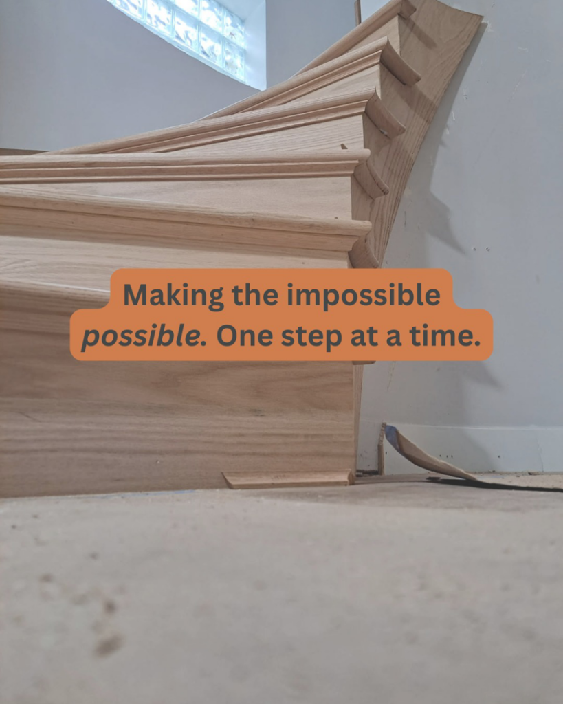 An unfinished wooden staircase being installed by Compass Construction & Remodeling in Milwaukee, WI, showcasing detailed craftsmanship.