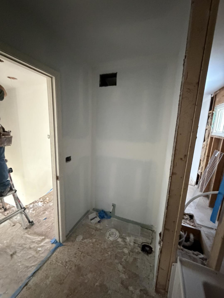 Utility area construction with new drywall and plumbing rough-ins by Building Better Homes Management in Cincinnati, OH.